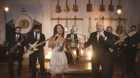 A group of people singing and playing instruments, perfect for providing lively wedding music or capturing the energetic spirit of a Boston band.